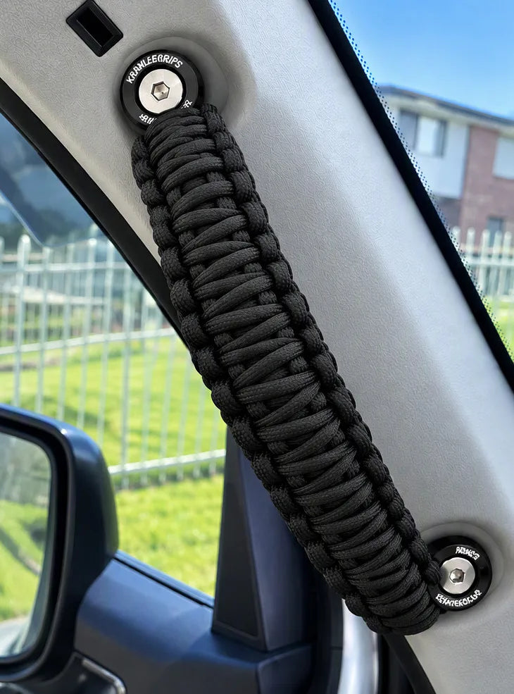 Black braided paracord grab handle fitted to a vehicle pillar